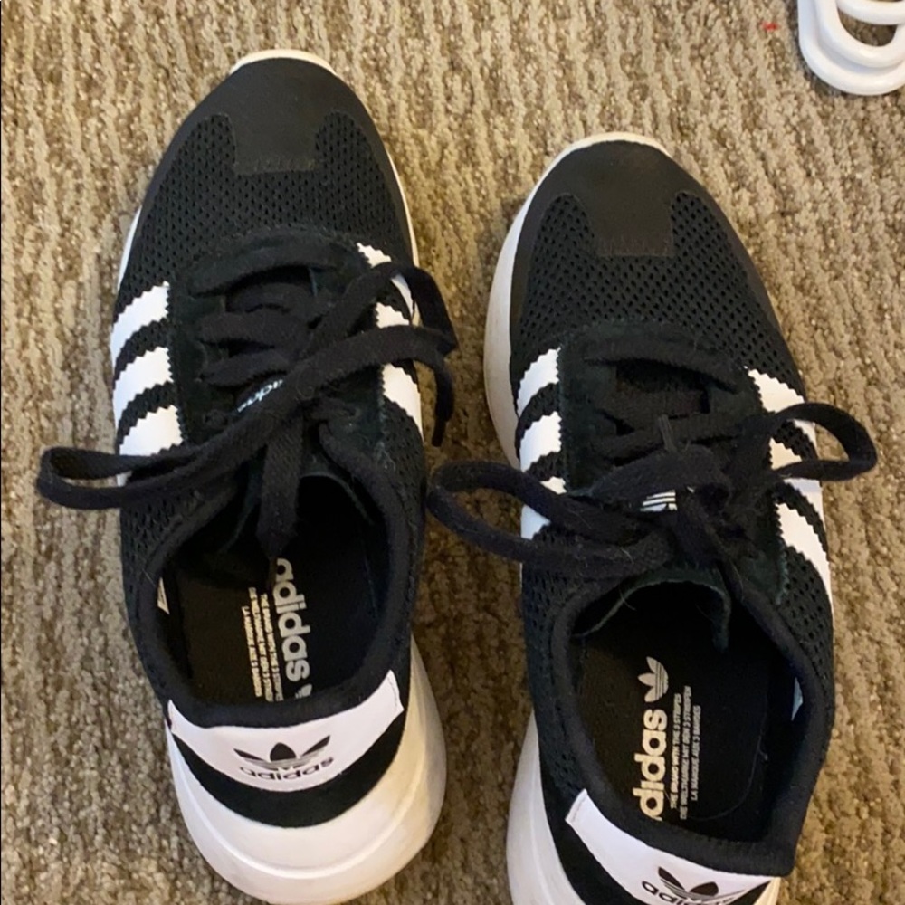 Black stripped adidas shoes